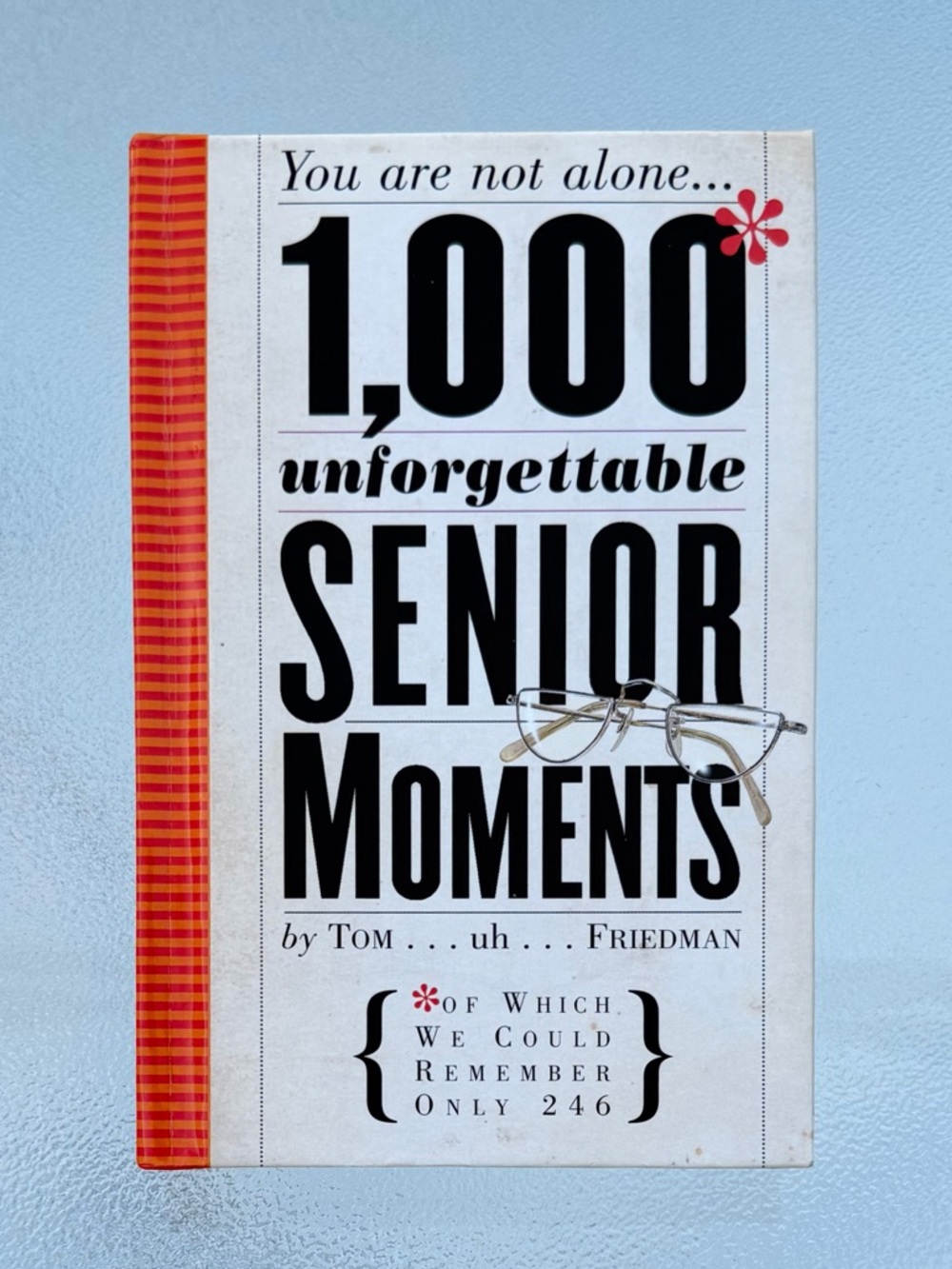 1,000 Unforgettable Senior Moments Paperback Book - White/Cream with Red Spine